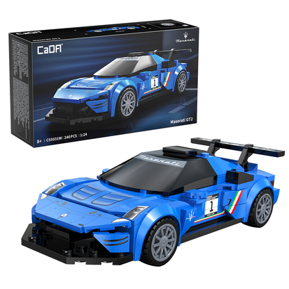 Cada Maserati MC20 GT2. Blue brick built sports car with black roof and visible branding in front of its packaging