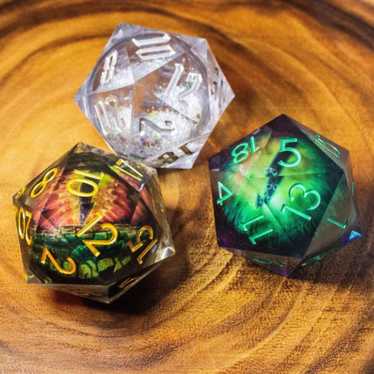 Chunky Liquid Core D20. Three polyhedral dice on a wooden surface