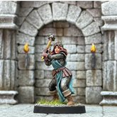 Cleric miniature holding a two-h...