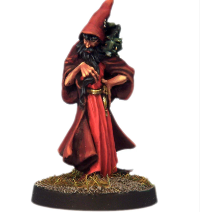 Miniature figurine of a wizard in a red robe and pointed hat on a white background