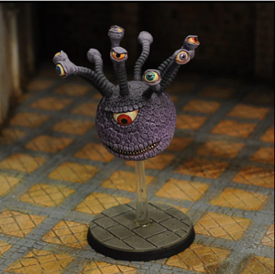 Crooked Dice Eye Tyrant A. Purple creature figurine with multiple eyes on a textured surface