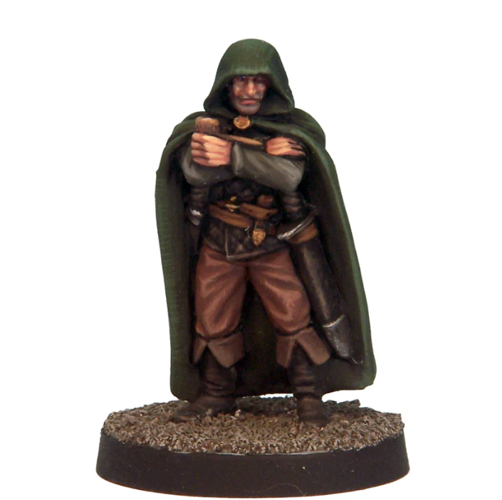 Figurine of a character in a green cloak and brown outfit on a white background. Crooked Dice Mysterious Stranger fantasy miniature pewter model
