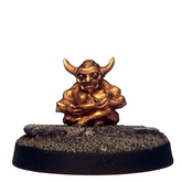 Small golden figurine on a dark ...