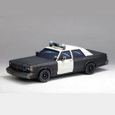 Model police car on a grey backg...