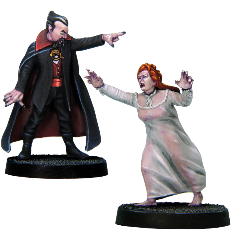 Dracula and Lucy by Crooked Dice, a pack of two white metal 28mm scale miniatures for your tabletop games representing a classic vampire dressed in a cape and pointing forward and a female vampire in a running stance in a simple dress or nightdress.