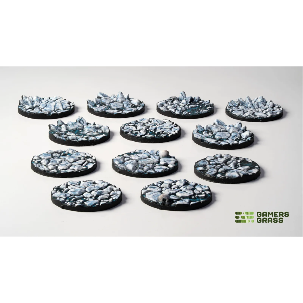Gamers Grass Frost Lake 25mm base topper. Set of round stone-like game miniatures on a white background with 'Gamers Grass' branding.