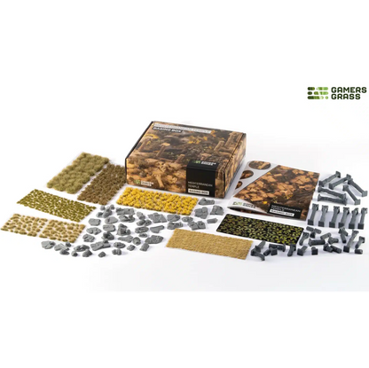 Gamers Grass Mediterranean Temple Basing Box. Gamers Grass Mediterranean Temple Basing Box contents overview. Collection of miniature grass and gravel sets with packaging on a white background, featuring the brand 'GAMERS GRASS'.