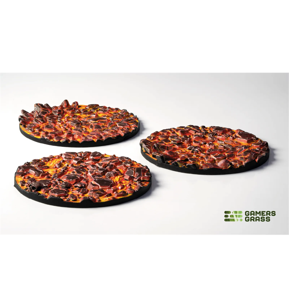 Gamers Grass Molten Lava Base Toppers - 50mm Round. Three round gaming mat with fiery design on a white background, featuring the 'Gamers Grass' logo.