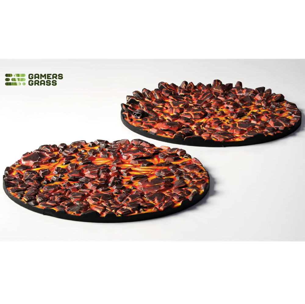 Gamers Grass Molten Lava Base Toppers - 60mm Round.Two round, fiery texture mats on a white background with 'Gamers Grass' branding.