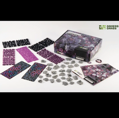 Gamers Grass Purple Swarm Basing Box alien terrain contents. Terrain  components including tufts and paper plants on a white background with 'Gamer Grass' branding.