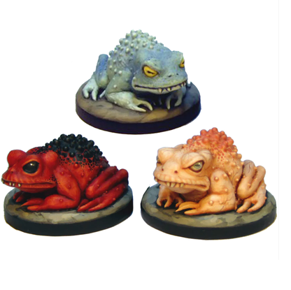 Giant Toads by Crooked Dice, a pack of three resin miniatures for your tabletop games representing toads with their legs tucked under their bodies and sharp teeth in their mouth