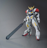 A white Gundam action figure hol...