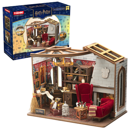 Miniature Harry Potter-themed dollhouse with detailed furniture and decor, displayed in front of its packaging.