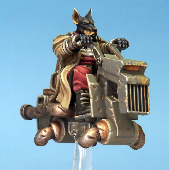 The Jet Bike 2 miniature features a dog character in a long coat riding a dog-shaped jet bike, showcasing detailed resin craftsmanship and supplied with a perspex flying base.