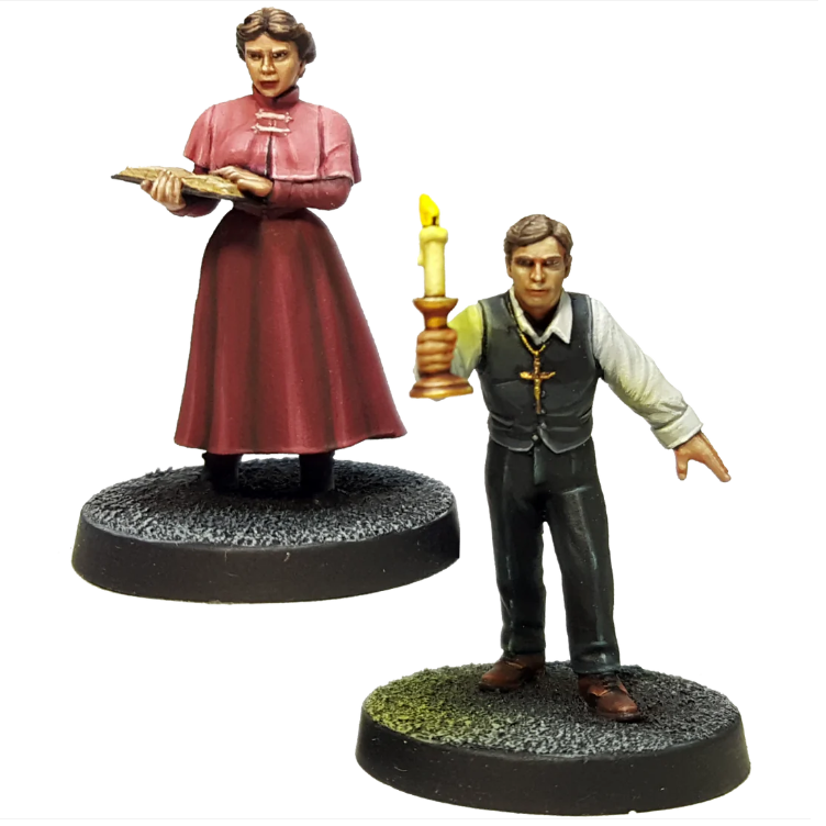 Jonathan and Mina Harker by Crooked Dice, a pack of two white metal 28mm scale miniatures for your tabletop games representing a male wearing a suit and waistcoat without the jacket and holding a candle and a female wearing a long skirt and smart clothes holding an open book.