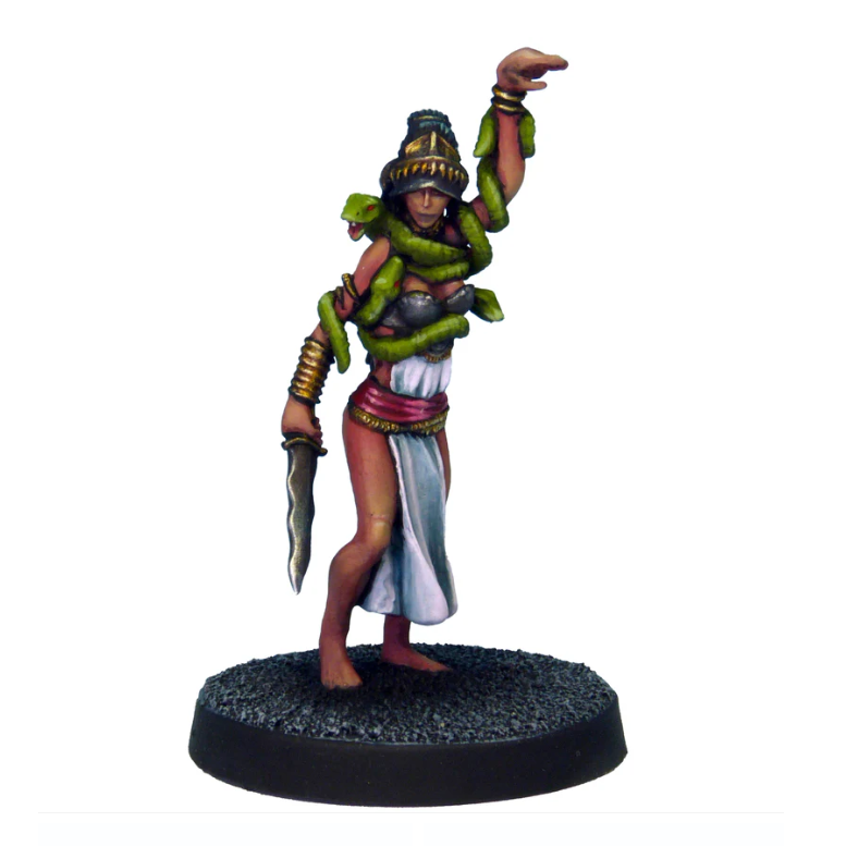 A female figure with long hair, holding a blade in one hand, arm raised with a snake head design, snakes entwined around her body and head, cast in white metal.