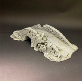 A miniature grey stone bridge or...