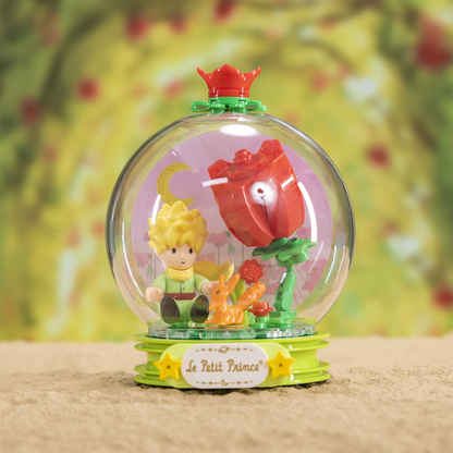 Le Petit Prince snow globe with character and rose figure on a floral background. Le Petit Prince Rose Whispers brick model kit