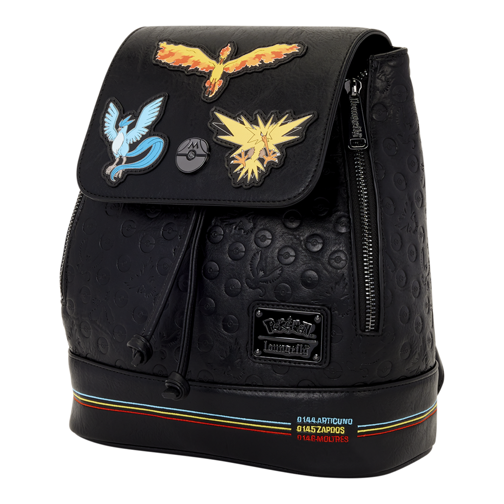 Black textured faux-leather backpack featuring embroidered Pokémon team patches on the front flap, including Eevee, Charizard, and Swirlix, with a Pokémon Tower logo patch and rainbow stripe accents near the base. Loungefly Pokémon Legendary Birds mini backpack featuring Articuno, Moltres and Zapdos
