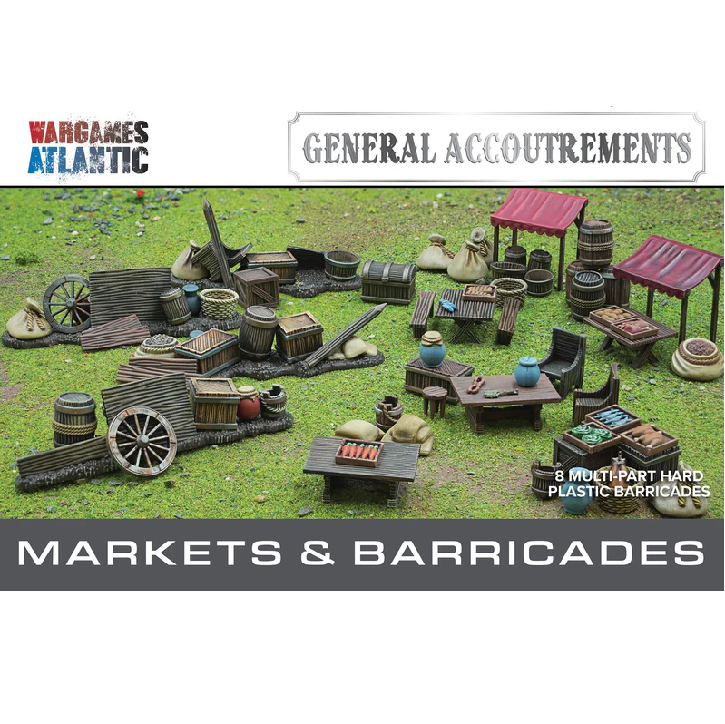 Wargaming accessories including markets and barricades on a grassy background with 'Wargames Atlantic' branding.