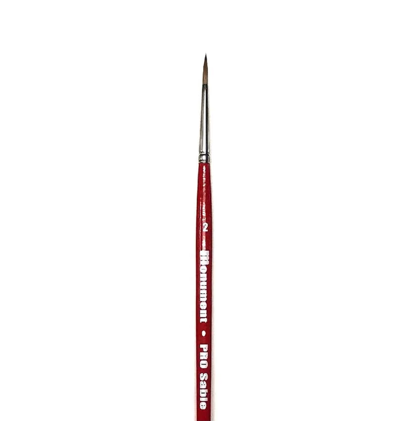 A fine detail paint brush with a red handle and a silver metal ferrule, featuring white text that reads 'Monument PRO Sable' on a plain white background. Monument Hobbies PRO Sable Paint Brush Round 2