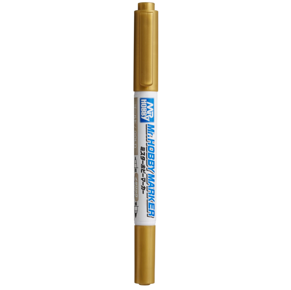 Gold marker with a white cap on a white background