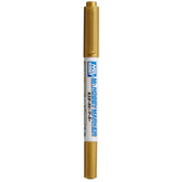 Gold marker with a white cap on ...