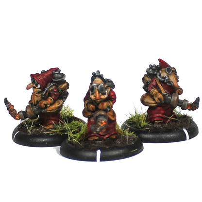 Oakbound Studio Bahkka Heatlancers. Three miniature figurines on black bases with grassy textures against a white background