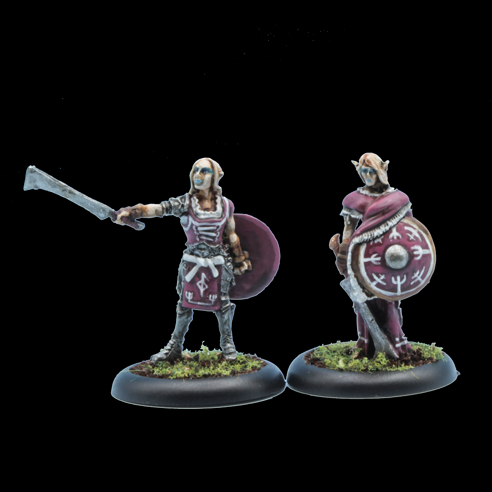 Oakbound Studio Huldra Soturi. Two miniature figures of warriors with shields and weapons on a black background