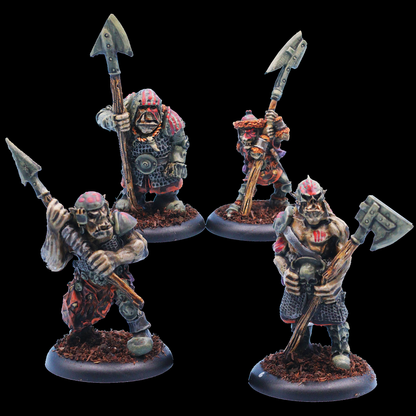 Oakbound Studio Stallu Warriors  Stallu Redcaps. Four warrior figurines with spears on a black background