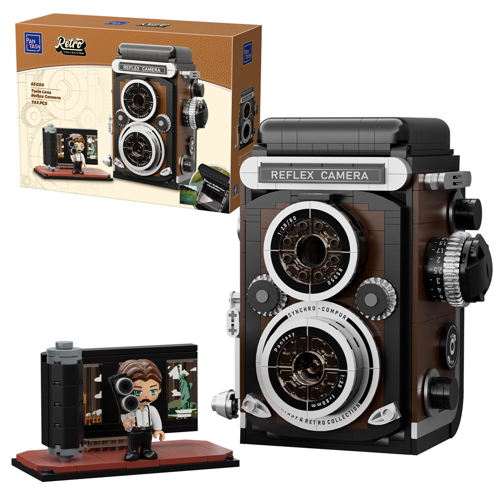 Toy reflex camera set with packaging and figure on a white background. PanTasy Retro Twin Lens Reflex Camera brick model kit

