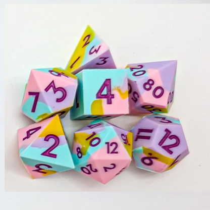 Pixie Prankster. Set of colourful polyhedral dice with numbers on a white background
