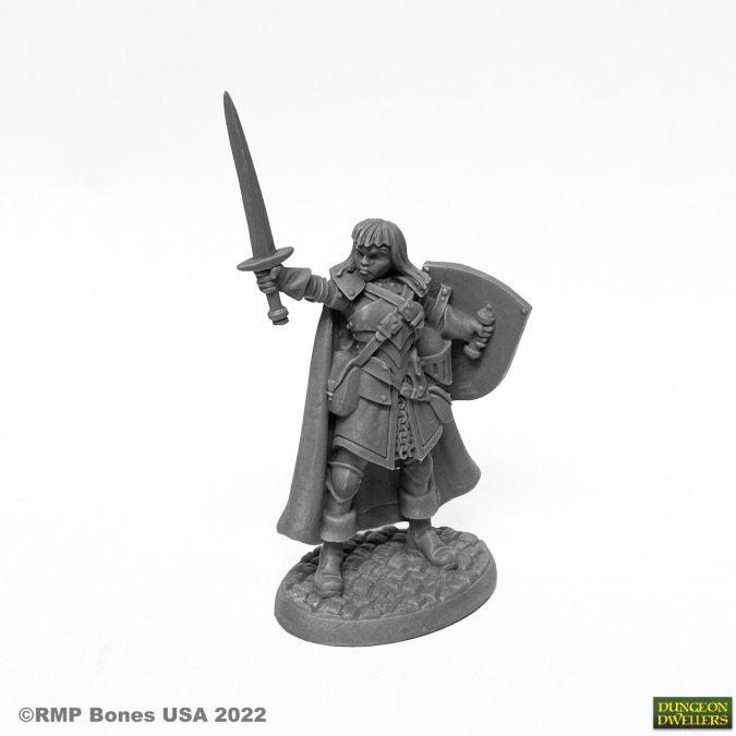 Reaper Caerindra Thistlemoor Bones USA Dungeon Dwellers 25mm heroic scale fantasy miniature. Grey miniature figure of a warrior with a sword and shield on a white background, featuring the Pinnacle Studios logo.