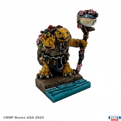Reaper Koga Mossback Spikeshell Druid Bones USA Reaper Legends 25mm fantasy turtle druid miniature. Miniature character with a weapon on a white background