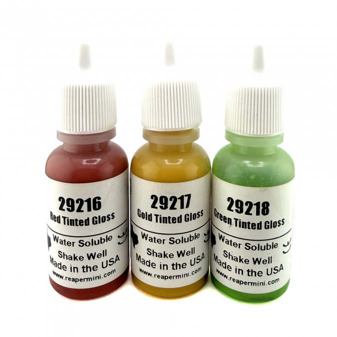 Three bottles of water-soluble tinted gloss with labels on a white background. Reaper Master Series Paint Tinted Glosses Triad #1 3 paint set