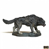 Grey wolf figurine on a white ba...