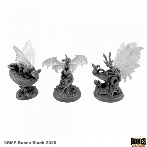 Three unpainted grey fantasy miniature figures of winged reptile-like creatures on round bases, shown against a white background with RMP Bones Black copyright text and logo. Reaper Miniatures 44299 Fairy Dragons