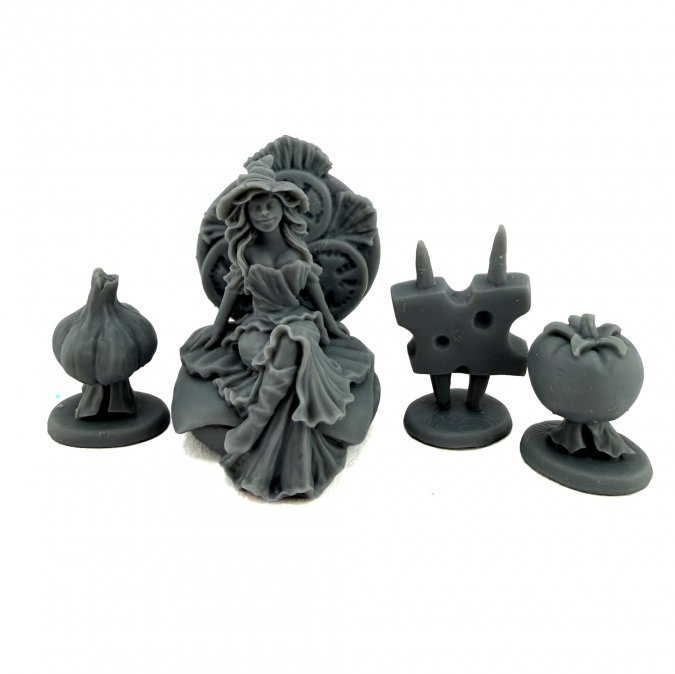 Four gray miniature figurines, likely for tabletop gaming, featuring a seated woman in a large dress, a garlic bulb, a cheese-like block, and a tomato, all on round bases against a white background. Reaper miniatures Patty the Sandwich Witch