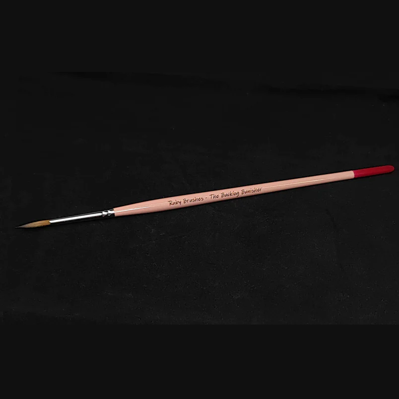 Kolinsky sable miniature paint brush Ruby Brushes Backlog Banisher. Paintbrush with silver ferrule on a black background