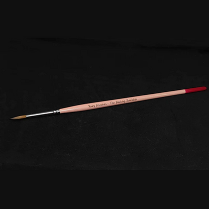 Kolinsky sable miniature paint brush Ruby Brushes Backlog Banisher. Paintbrush with silver ferrule on a black background
