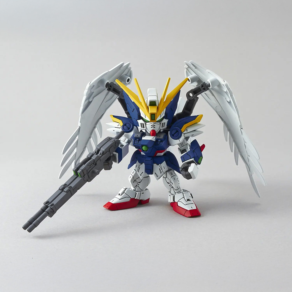 Model kit of a robot with wings on a grey background. SD Gundam Ex-Standard XXXG-00W0 Wing Gundam Zero EW