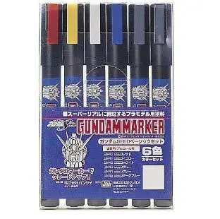 A 6-color pack of Gundam marker pens in a blue retail box, showing the cap colors: red, yellow, white, blue, gray, and black. Seed Basic Set Gundam Marker Set
