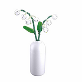White vase with green plant desi...