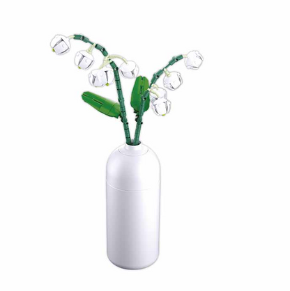 White vase with green plant design on a white background. Sluban Lilies of the Valley brick kit