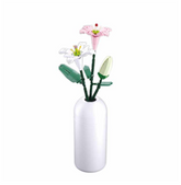 White vase with artificial flowe...