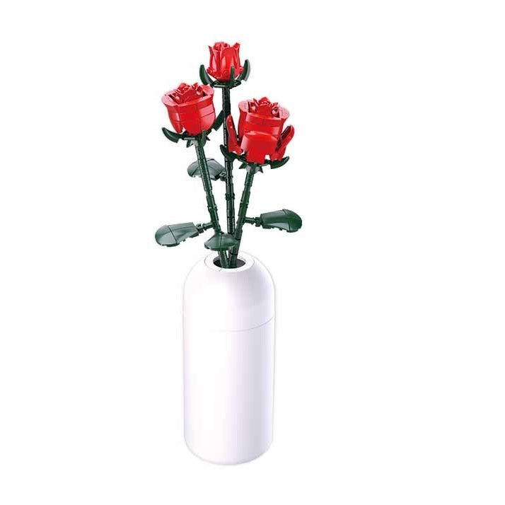 White vase with red roses on a white background.  Sluban Red Rose brick kit Lego compatible 