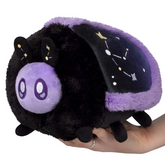 A black and purple plush toy sha...