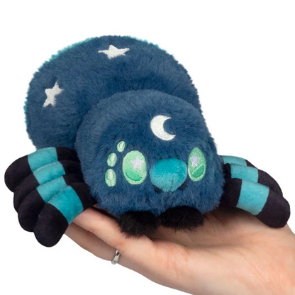 Blue plush spider toy with star and moon patterns held in a hand against a white background Squishable Midnight Spider - Alter Egos Series 20