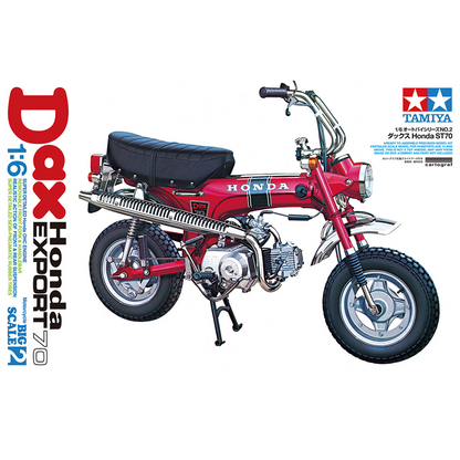 Model motorcycle kit of a Honda Dax Export on a white background with Tamiya branding. Tamiya 1:6 Honda Dax Export 70 Motorcycle Plastic Model Kit