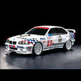 A white BMW M1 race car with mul...